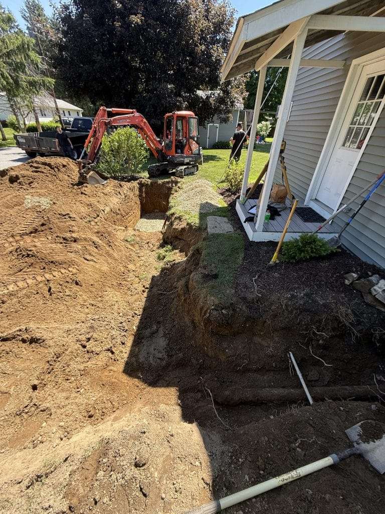 Foundation excavation alongside a home by Oakley Builders, Hudson Valley NY