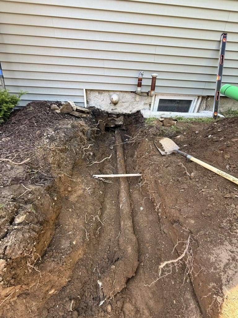 Foundation excavation and trenching along a house by Oakley Builders, NY