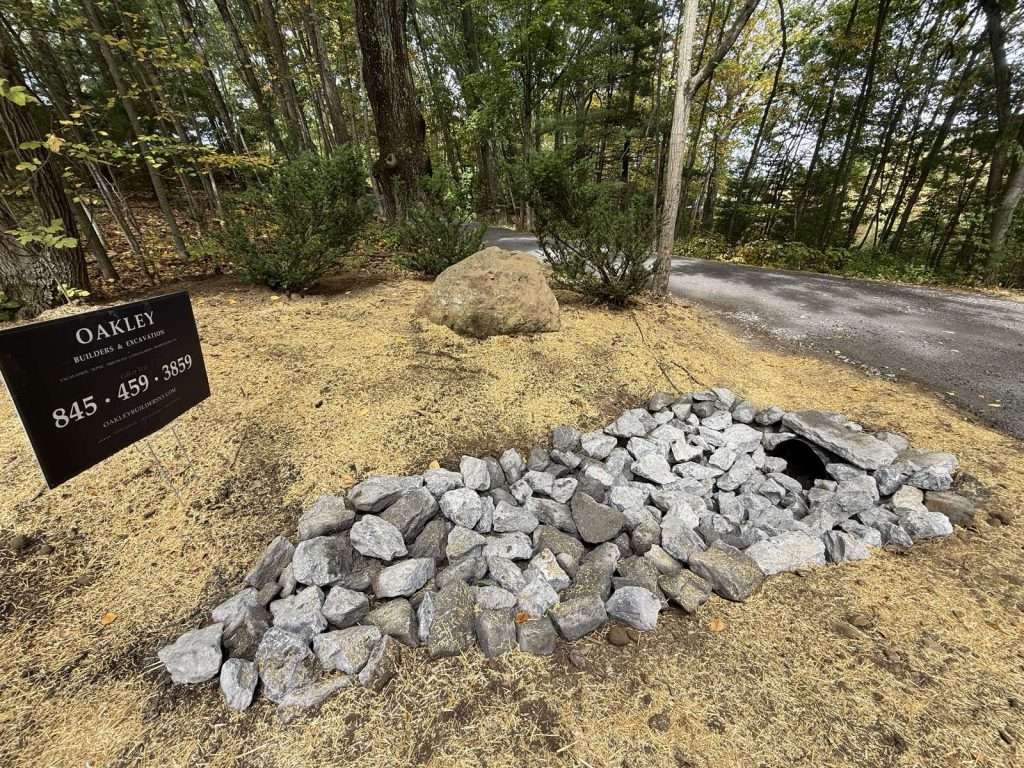 Culvert outlet at a driveway entrance in Pine Plains NY, armored with rip-rap stone to stop washout